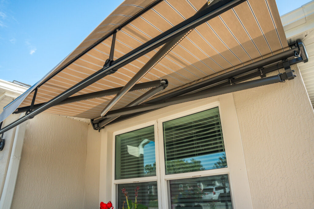 Awning-Crossarm-BronzeHousing-PuttyRegimentalFabric-PartiallyExtended